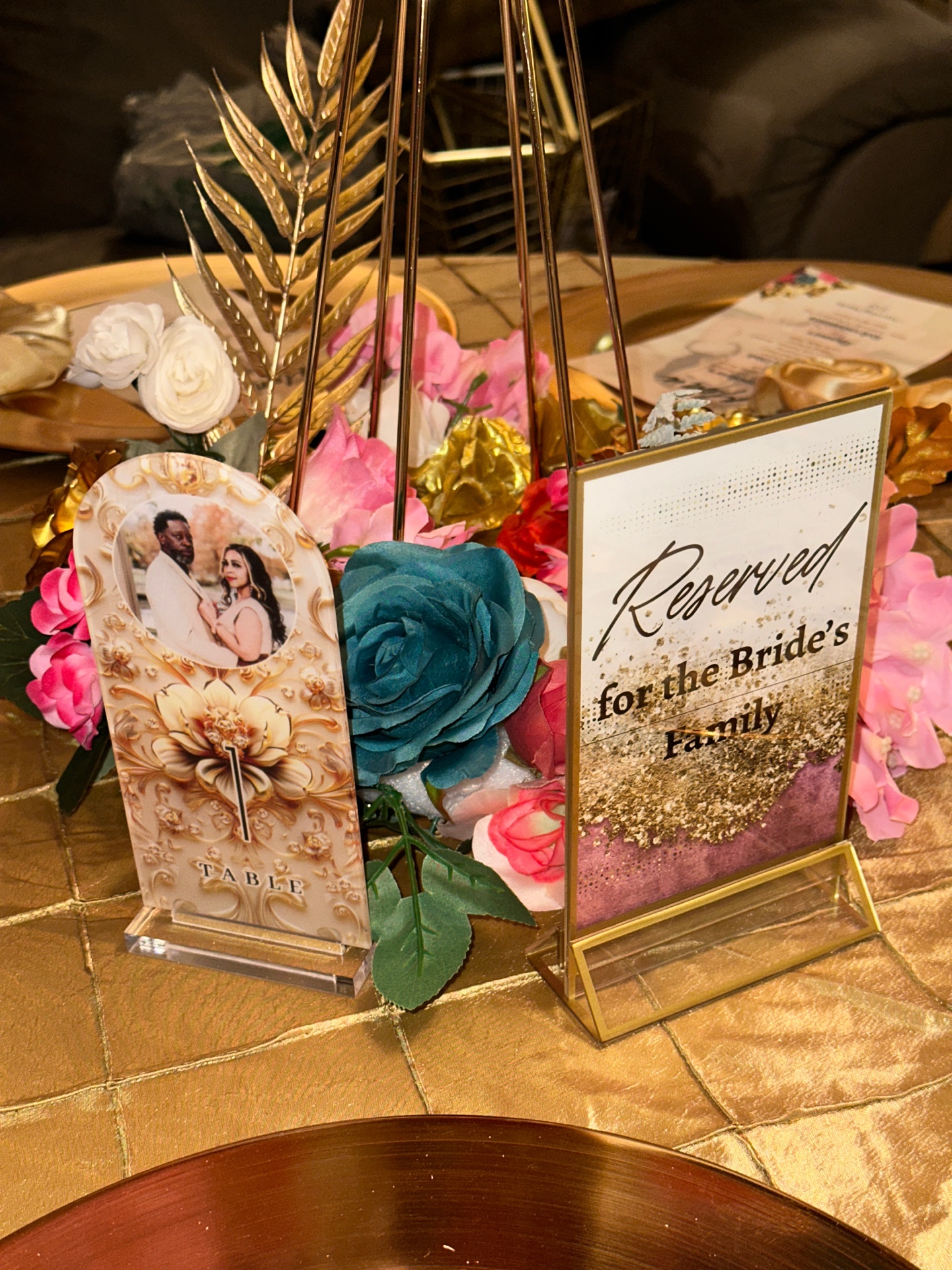 Floral centerpiece with Reserved for Bride's Family sign