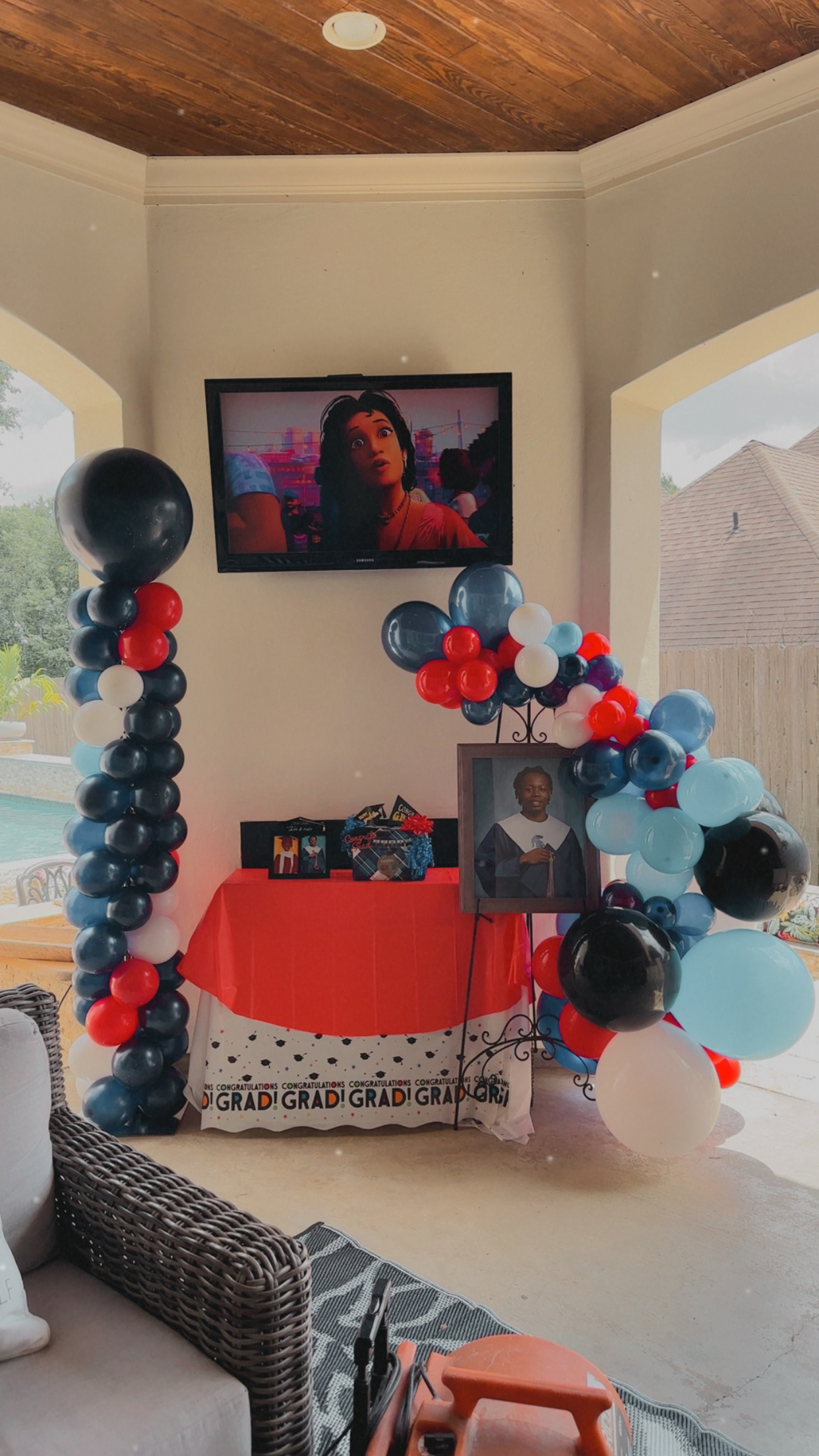 Navy, red and white graduation balloon columns and garland setup